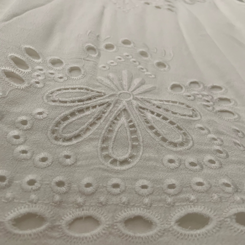 White embroidered sleeveless blouse
